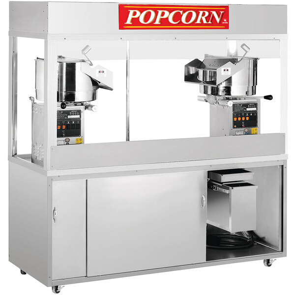 A Cretors floor model popcorn machine with two kettles, one large and one small.