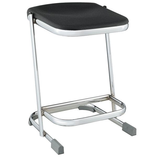 A black National Public Seating elephant Z-stool with chrome legs and seat.