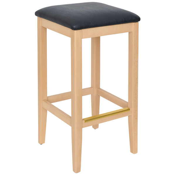 A BFM Seating wooden barstool with a black cushion.