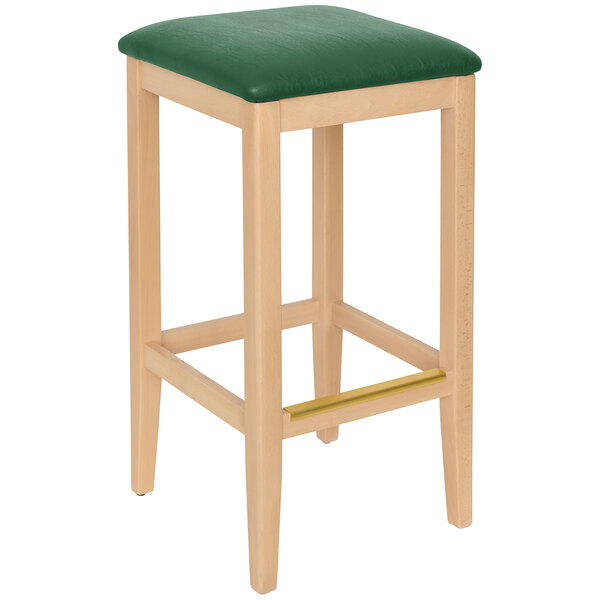 A BFM Seating Stockton beechwood barstool with a green cushion on a white surface.