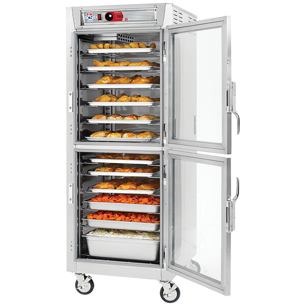 A Metro C5 series stainless steel holding cabinet with clear Dutch doors full of food.