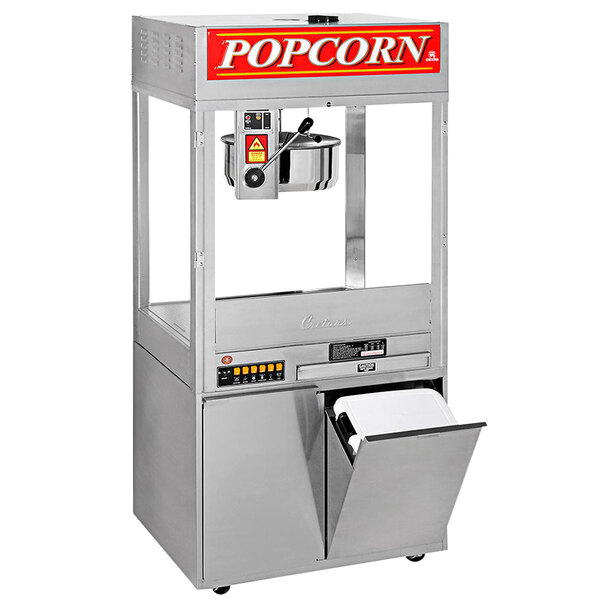 A Cretors countertop popcorn machine with a lid popping popcorn.