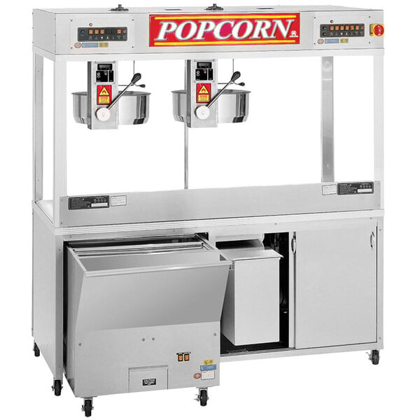 A Cretors popcorn machine with two kettles and a tray.