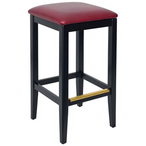 A black BFM Seating barstool with a burgundy vinyl seat.