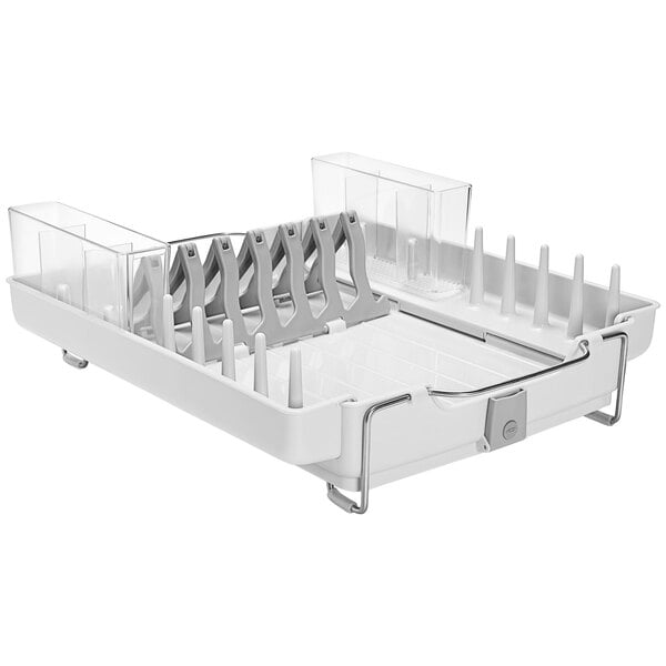 A white OXO Good Grips plastic dish rack with utensils in it.
