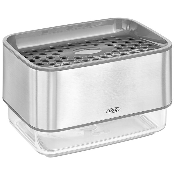 An OXO stainless steel and clear container with holes in it.