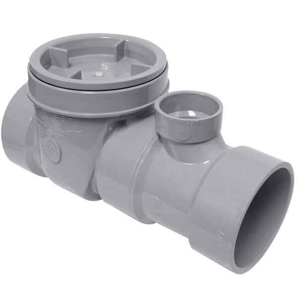 A grey plastic pipe with a round cap.