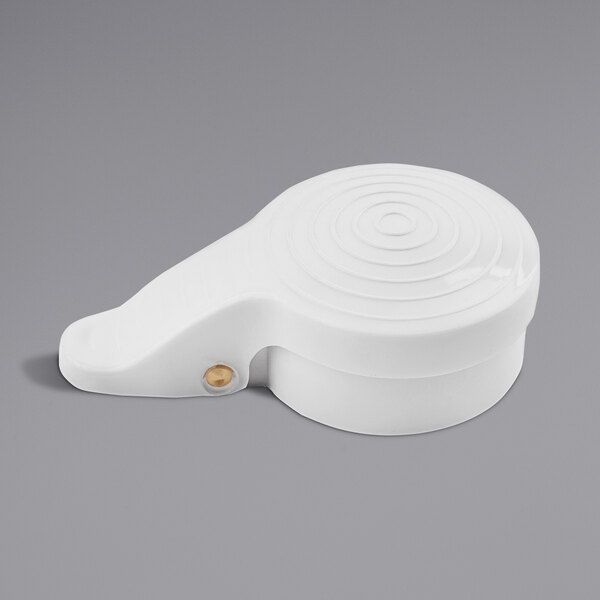 A white plastic lid with a round handle.