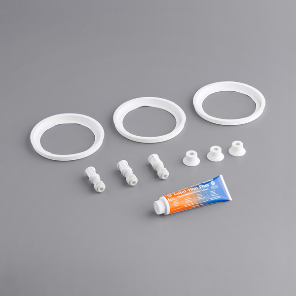A Narvon preventative maintenance kit for a slushy machine with white plastic parts.