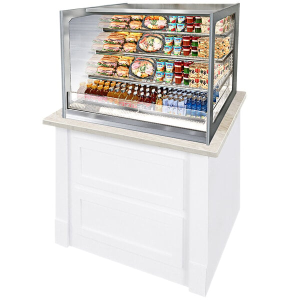 A Federal Industries Italian Glass Countertop Display Case with food on shelves.