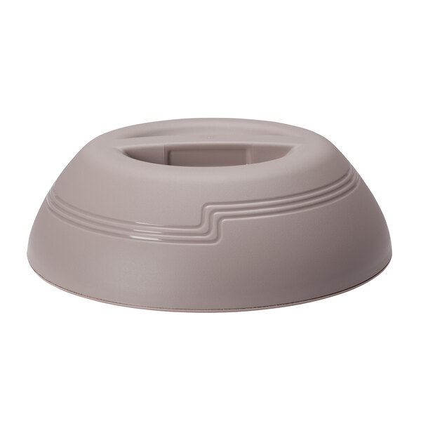A wheat-colored plastic low profile dome plate cover with a circular design on top.
