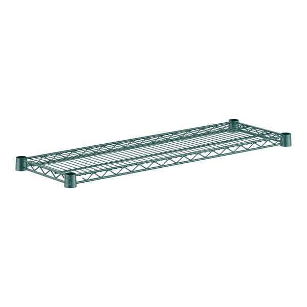 A green metal Regency wire shelf with rectangular holes.