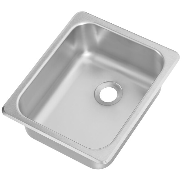 A Vollrath silver self-rimming sink bowl with a drain.