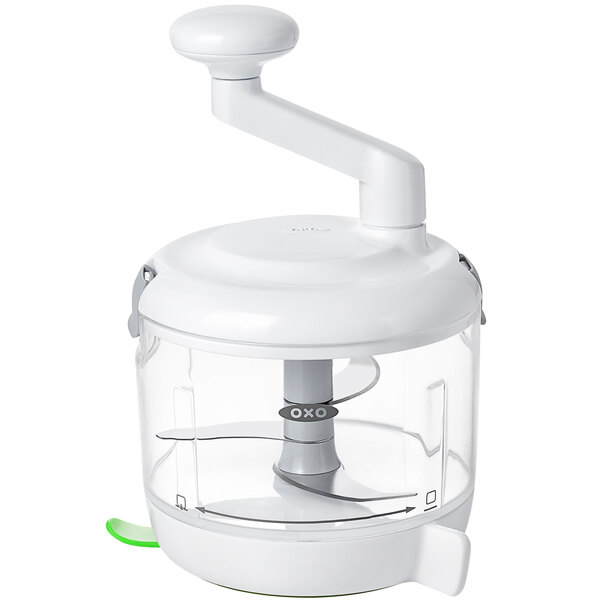 An OXO white food processor with a green handle.