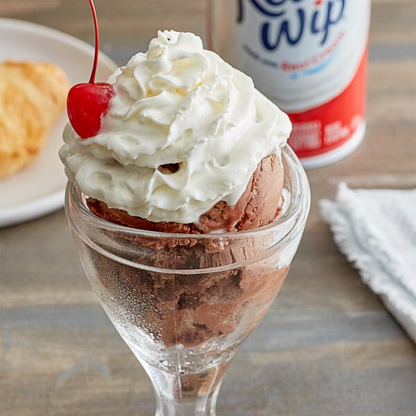 A glass with ice cream topped with Reddi-Wip original whipped cream.