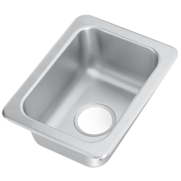 A stainless steel Vollrath sink bowl with a drain.