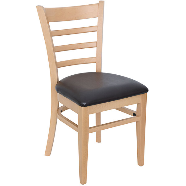 A BFM Seating Berkeley natural beechwood restaurant chair with a black vinyl seat.