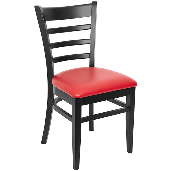 A BFM Seating black beechwood restaurant chair with a red vinyl seat.