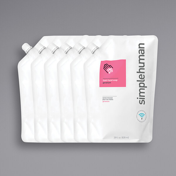 A group of white plastic bags with a pink and white label reading "simplehuman Geranium Scented Foam Hand Soap Refill"