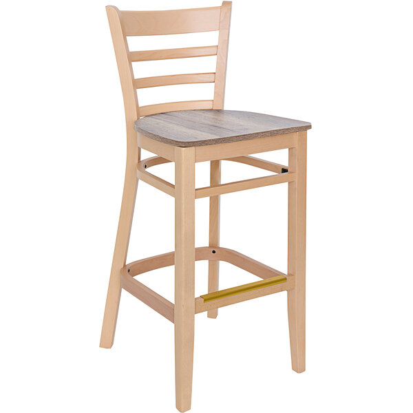 A BFM Seating wooden barstool with a ladder back and beechwood seat.