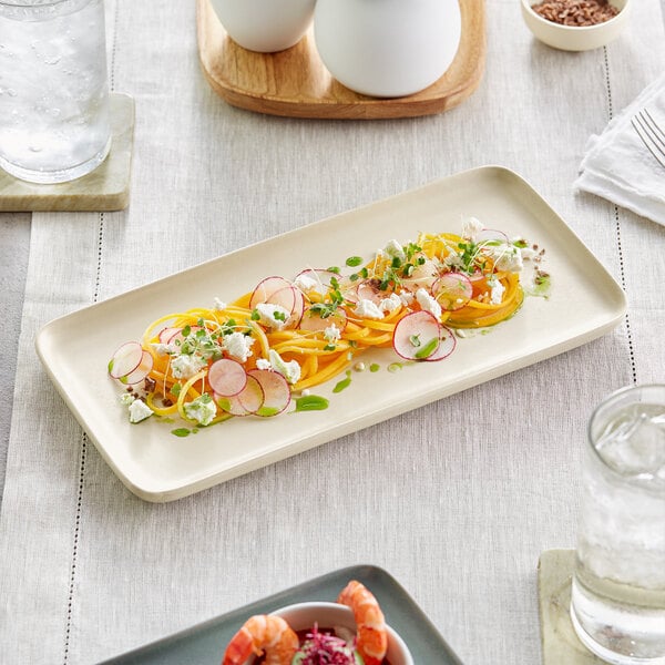 An Acopa Pangea rectangular white porcelain platter with a salad and shrimp on it.