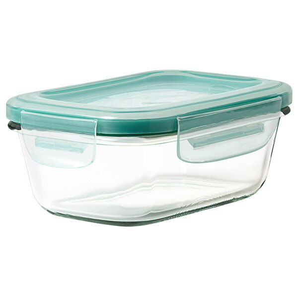 An OXO clear rectangular glass container with a green lid.