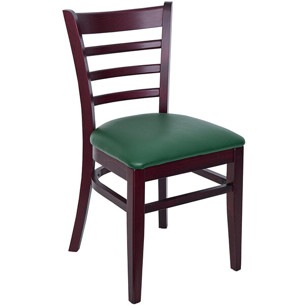 A BFM Seating wooden ladder back chair with a green vinyl seat.