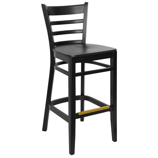 A black BFM Seating ladder back bar stool with a wood veneer seat.