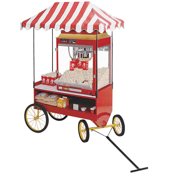 A red and white Cretors steerable wagon base with a canopy over popcorn.