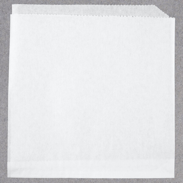 A white paper with a scalloped edge.