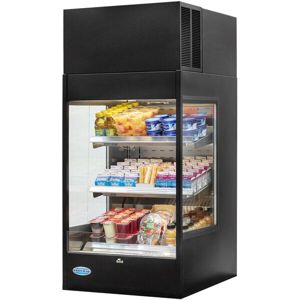 A black Federal Industries countertop refrigerated display case with food on shelves.