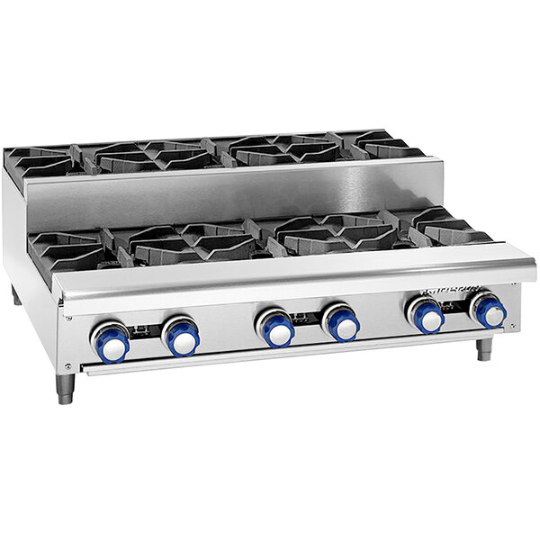 A stainless steel Imperial countertop gas range with six blue-knobbed burners.