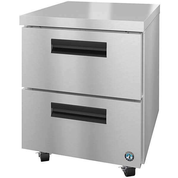 A silver Hoshizaki undercounter refrigerator with 2 drawers on wheels.