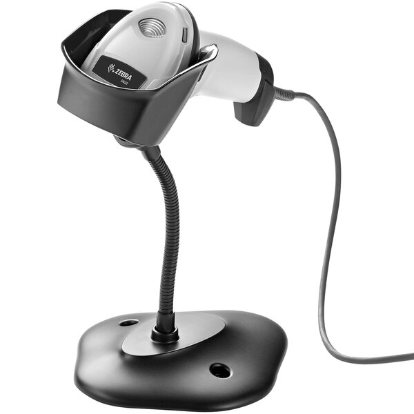 A white Zebra DS2208 barcode scanner on a stand.