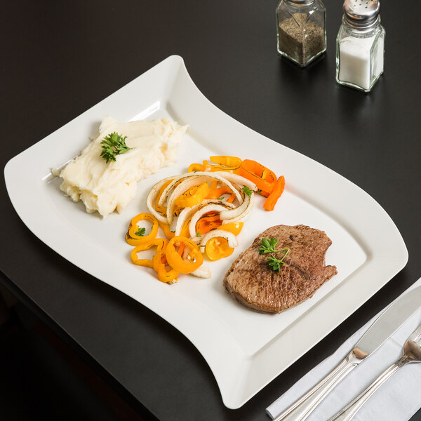 A Fineline ivory plastic plate with steak, vegetables, and potatoes on it.
