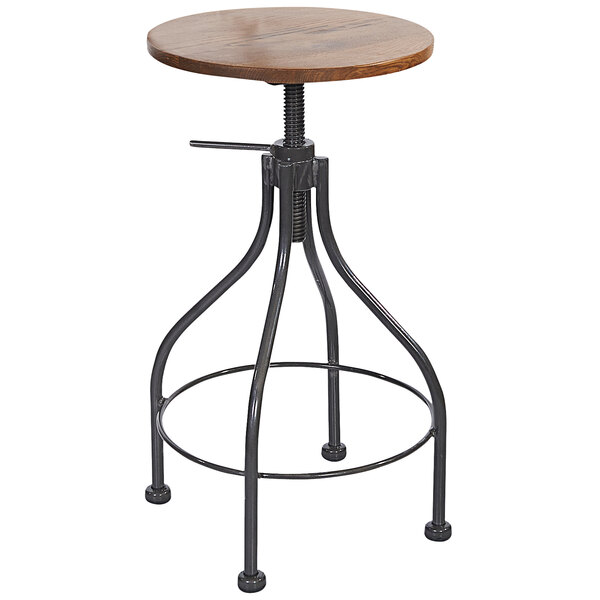 A clear coated steel backless barstool with a wooden top and metal ring.