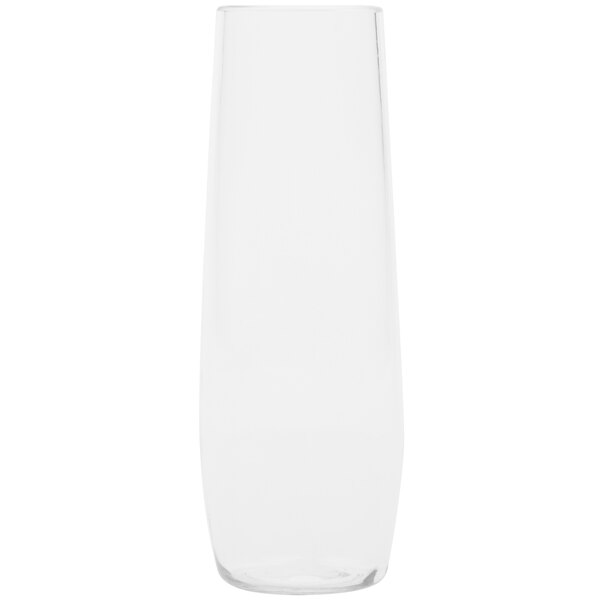 A clear plastic stemless champagne flute with a white background.