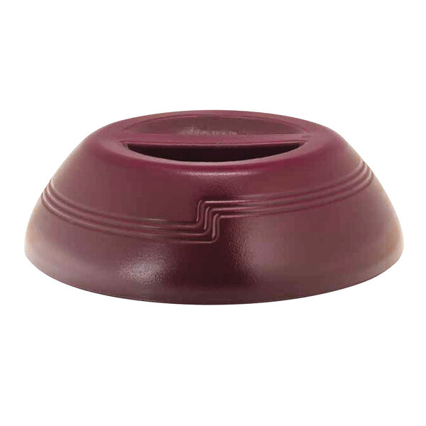 A red plastic dome plate cover with a slot.