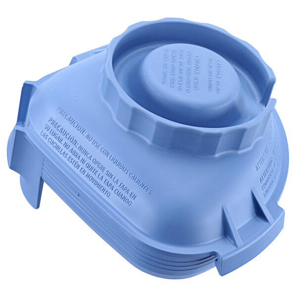 A blue plastic lid with text for a Vitamix Advance Jar.