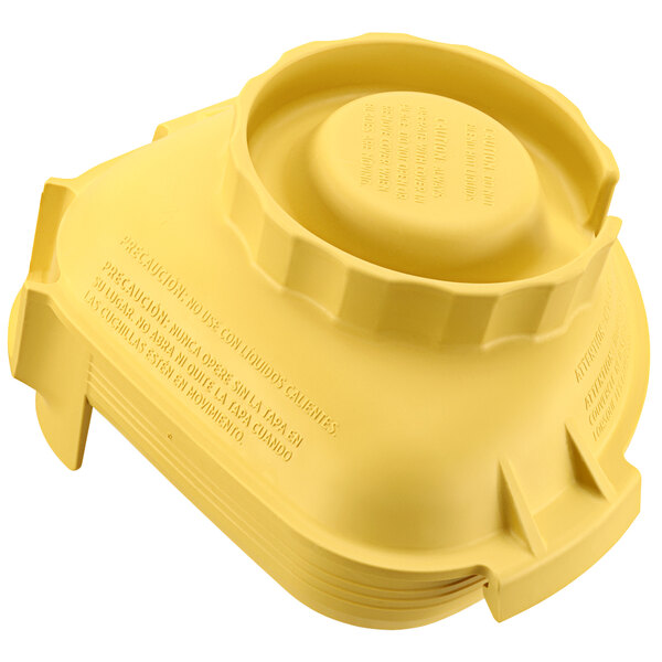 A yellow plastic container with a round lid.