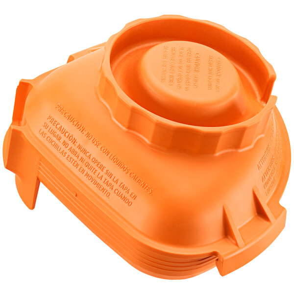 An orange plastic lid for Vitamix Advance jars.