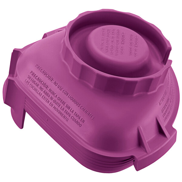 A purple plastic lid for a Vitamix Advance jar.