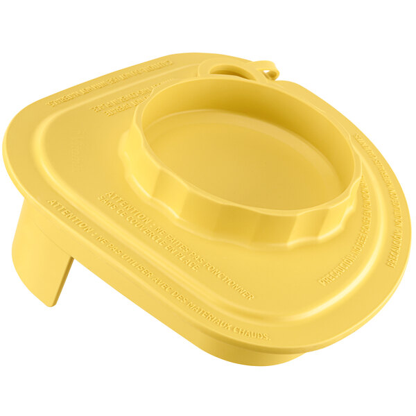 A yellow plastic lid with a tether for Vitamix Advance jars.
