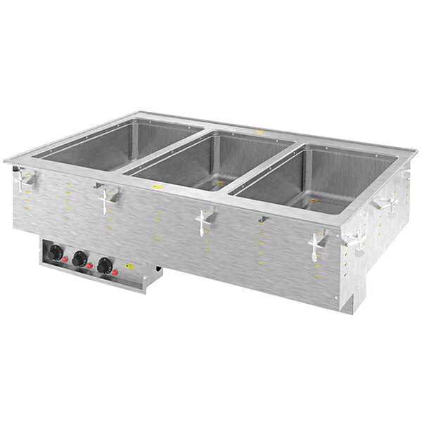 A Vollrath stainless steel drop-in hot food well with three compartments on a counter.
