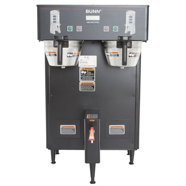 A Bunn commercial coffee machine with two black coffee pots on top.