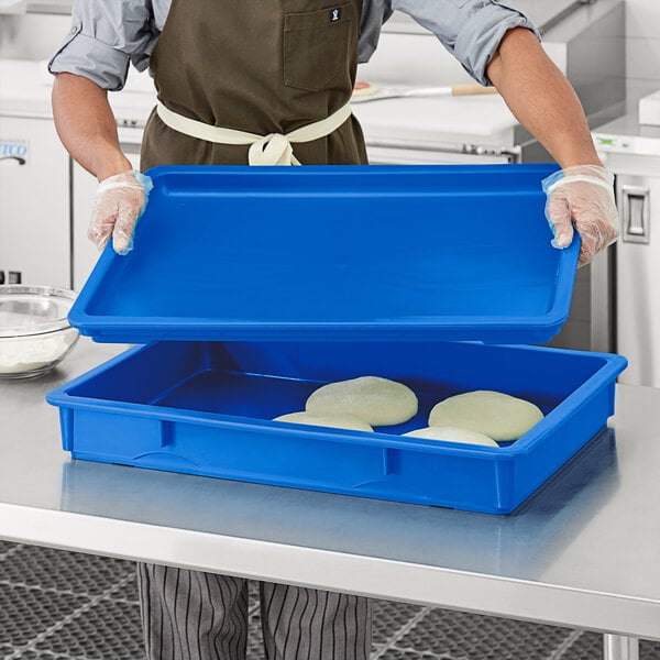 A blue rectangular lid for a Baker's Mark dough proofing box.
