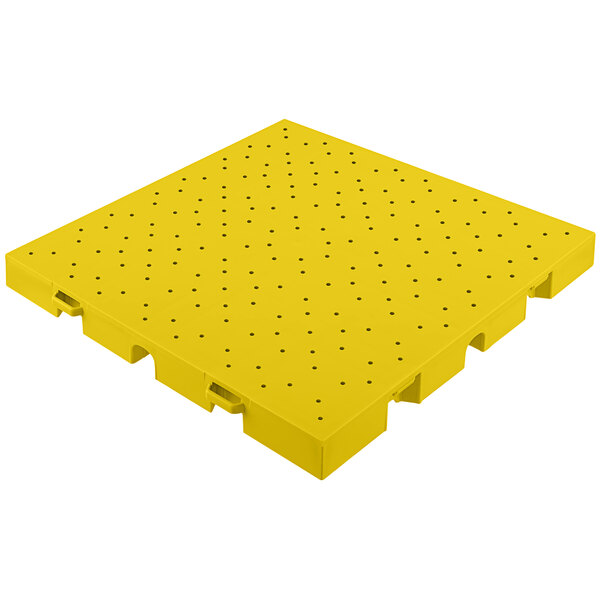 Yellow plastic EverBlock Flooring drainage top with holes.