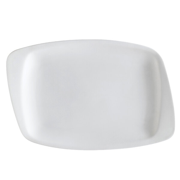 A CAC white porcelain platter with a rounded edge.