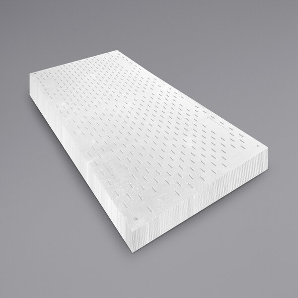 A white rectangular EverRoad access mat with holes in it.