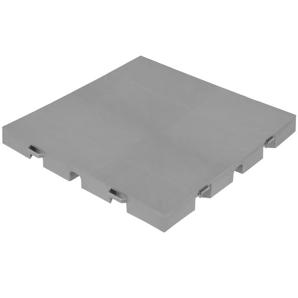 A grey plastic square with four holes.
